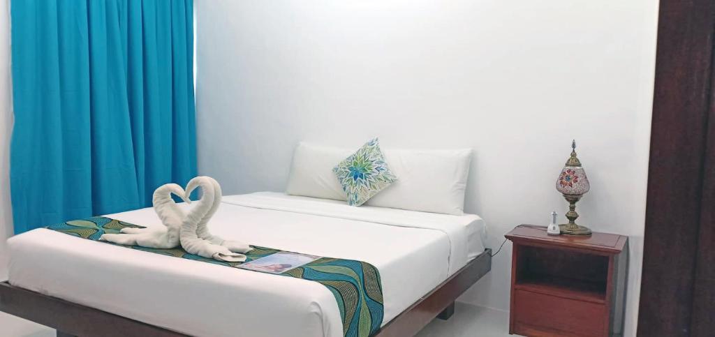 Postel nebo postele na pokoji v ubytování Discover Boracay Hotel