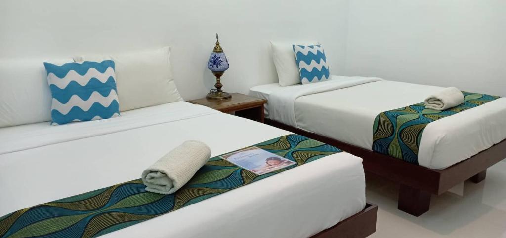 Postel nebo postele na pokoji v ubytování Discover Boracay Hotel