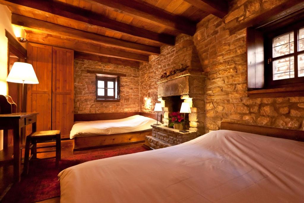 A bed or beds in a room at Arhontiko Aristis