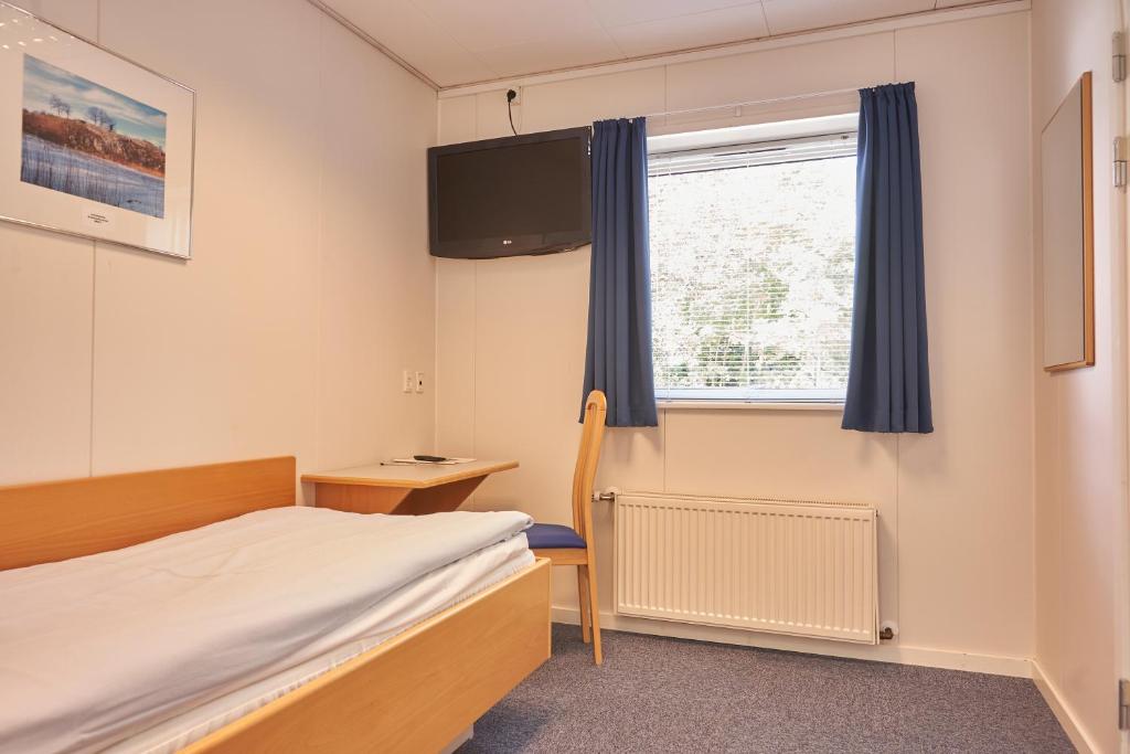 Postel nebo postele na pokoji v ubytování BB-Hotel Herning "Messehotel"