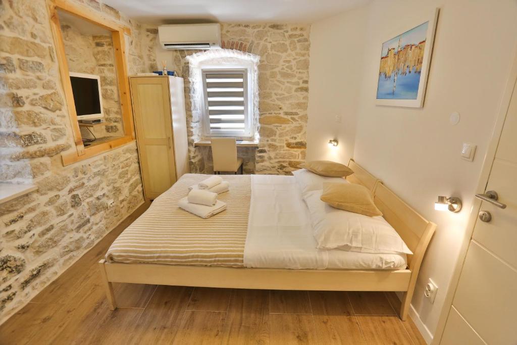 Postel nebo postele na pokoji v ubytování Split Inn Apartments