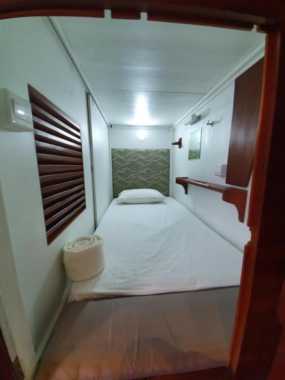 Postel nebo postele na pokoji v ubytování Bed Station 210