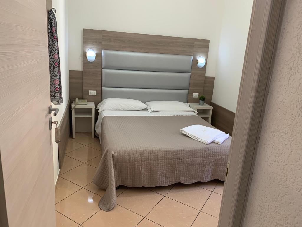 Postel nebo postele na pokoji v ubytování Hotel Siro