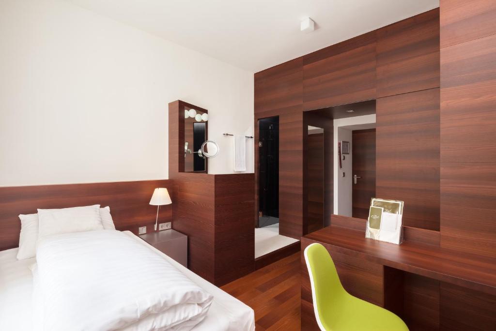 Postel nebo postele na pokoji v ubytování Hotel Central