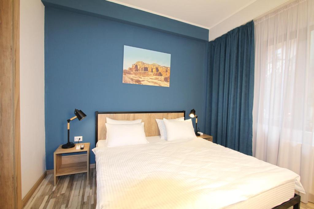 Postel nebo postele na pokoji v ubytování Apart-hotel TARHUN