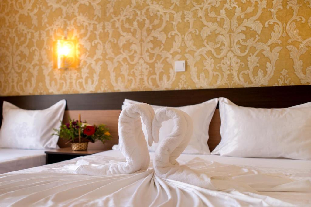 Postel nebo postele na pokoji v ubytování Hotel Iris