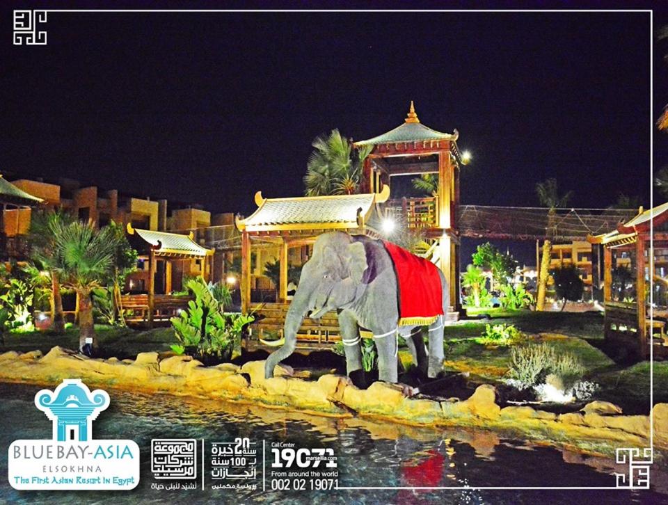 a statue of an elephant standing in front of a building at Mohamed Afifi BlueBay Asia - Families - Ground 2 Bed Rooms in Ain Sokhna