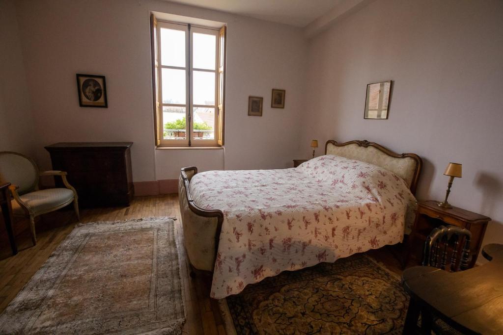 Postel nebo postele na pokoji v ubytování La Buffonnerie
