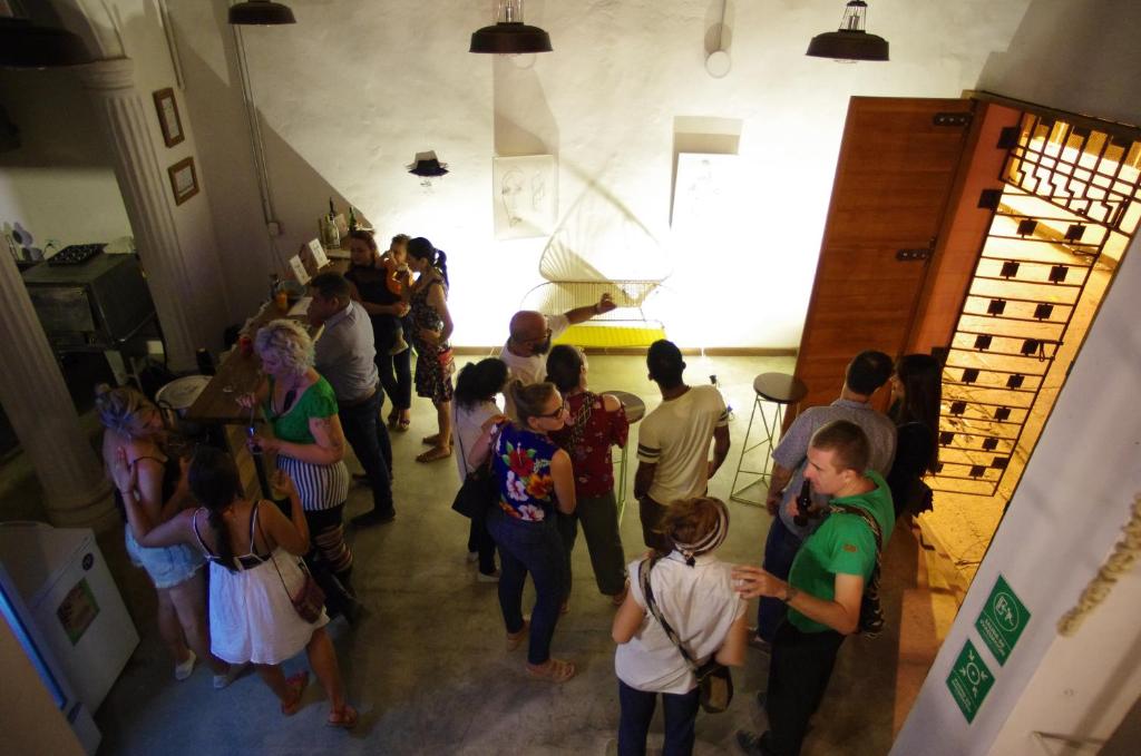 a group of people standing in a room at Casa Tunido in Santa Marta