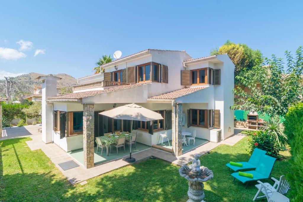 a villa with a view of the garden at S'Olivaret -Alcudia- in Port d'Alcudia