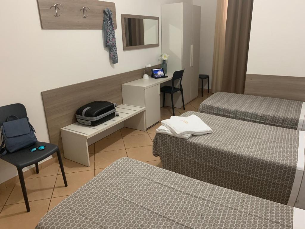 Postel nebo postele na pokoji v ubytování Hotel Siro