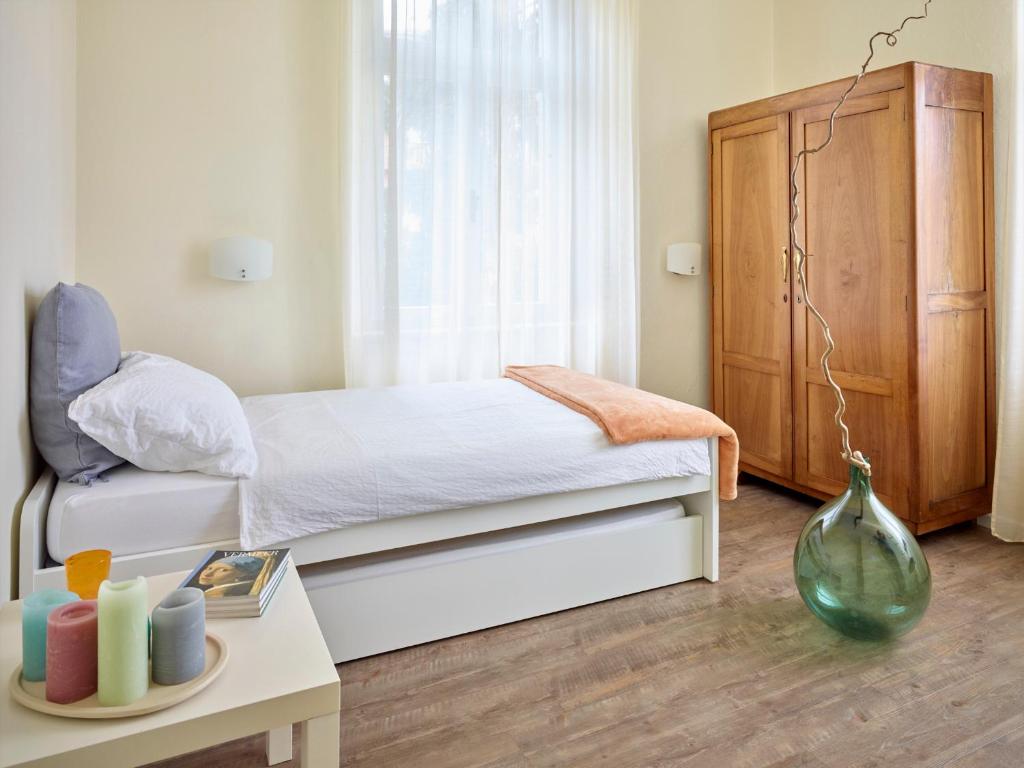 Postel nebo postele na pokoji v ubytování Albergo Garnì Villa Moretti