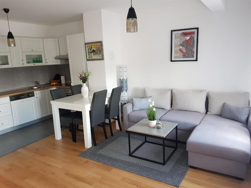 a living room with a couch and a table at Apartman DIJANA in Banja Luka