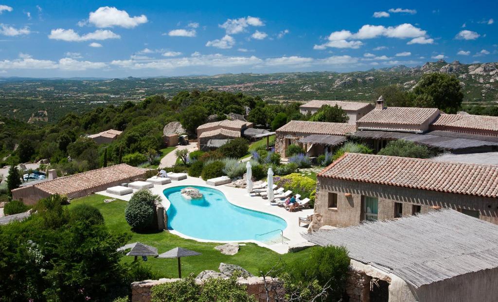 an aerial view of a villa with a swimming pool at Petra Segreta Resort & Spa in San Pantaleo