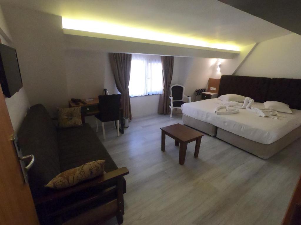 Postel nebo postele na pokoji v ubytování Tymbris Hotel Eskisehir