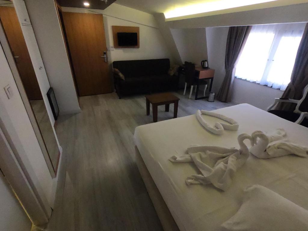 Postel nebo postele na pokoji v ubytování Tymbris Hotel Eskisehir