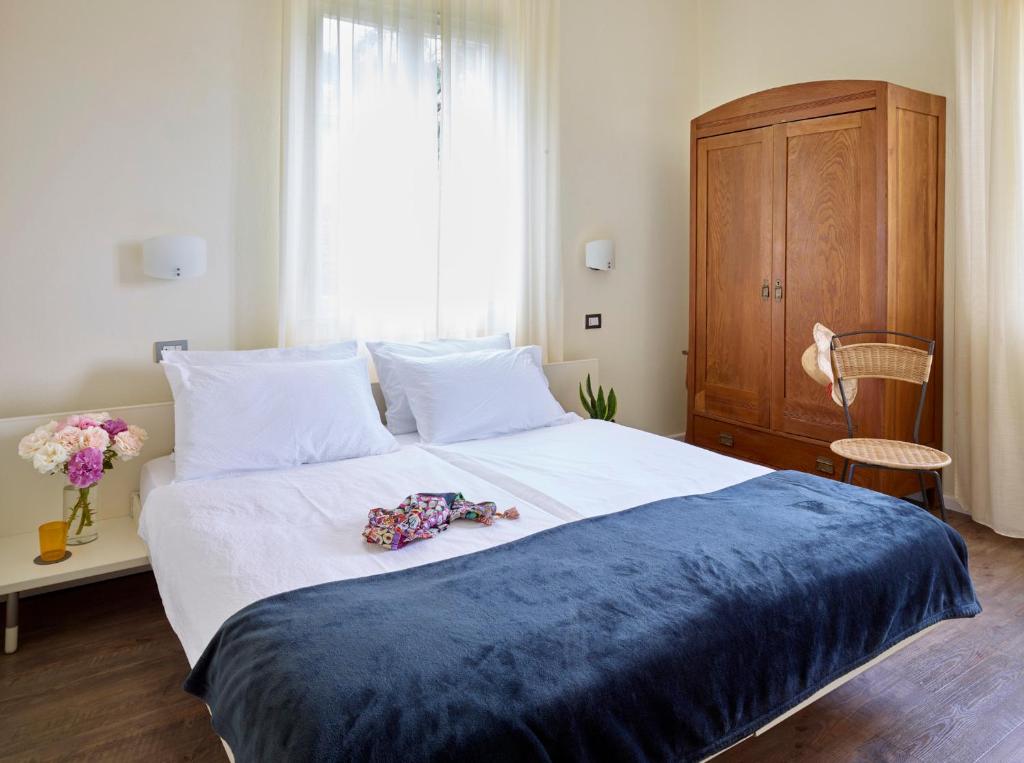 Postel nebo postele na pokoji v ubytování Albergo Garnì Villa Moretti