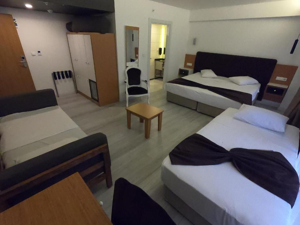 Postel nebo postele na pokoji v ubytování Tymbris Hotel Eskisehir