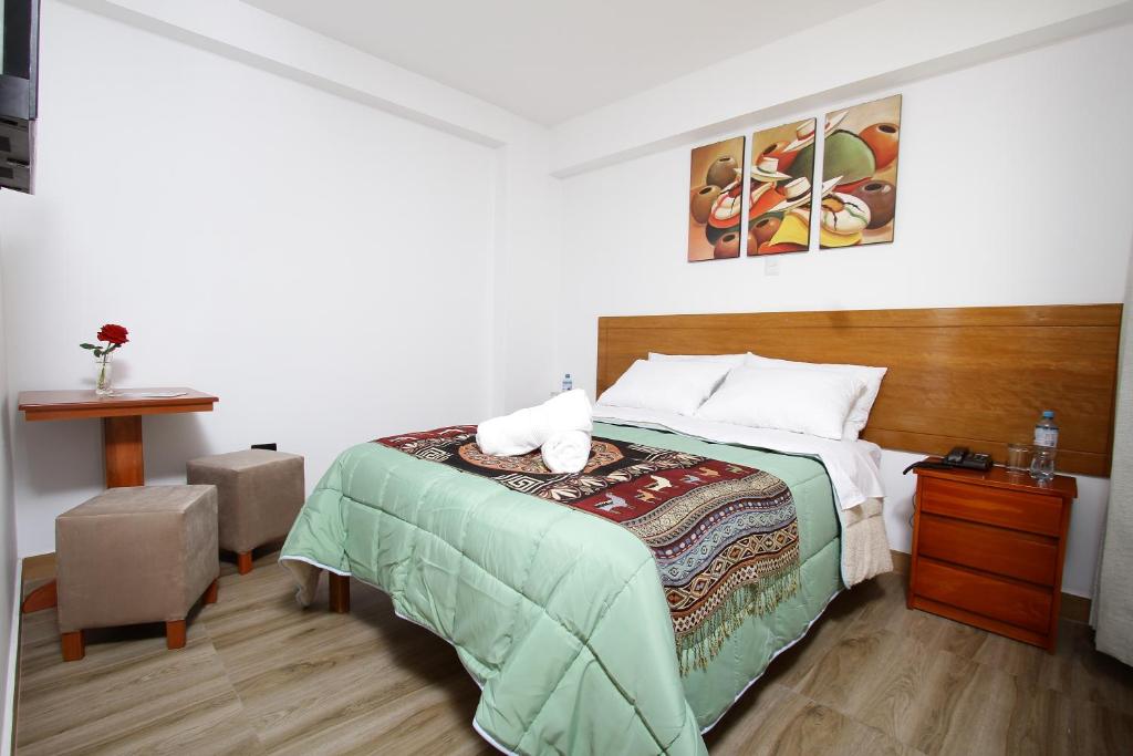 Postel nebo postele na pokoji v ubytování Latinos House Cusco