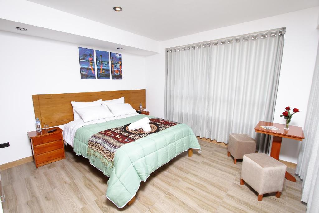 Postel nebo postele na pokoji v ubytování Latinos House Cusco