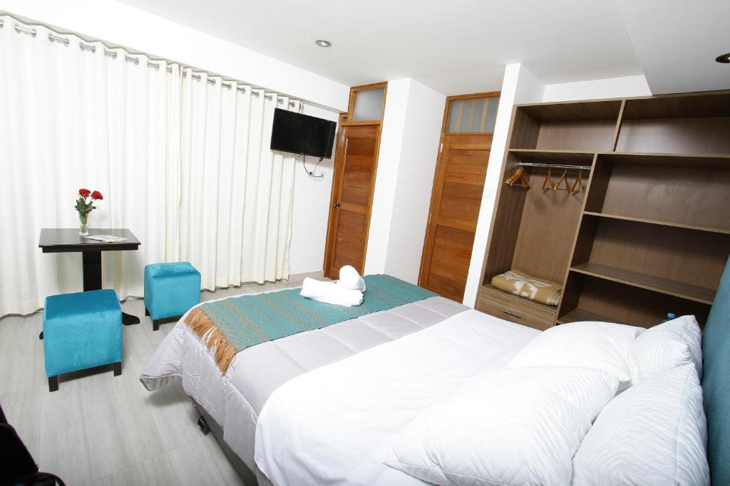 Postel nebo postele na pokoji v ubytování Latinos House Cusco