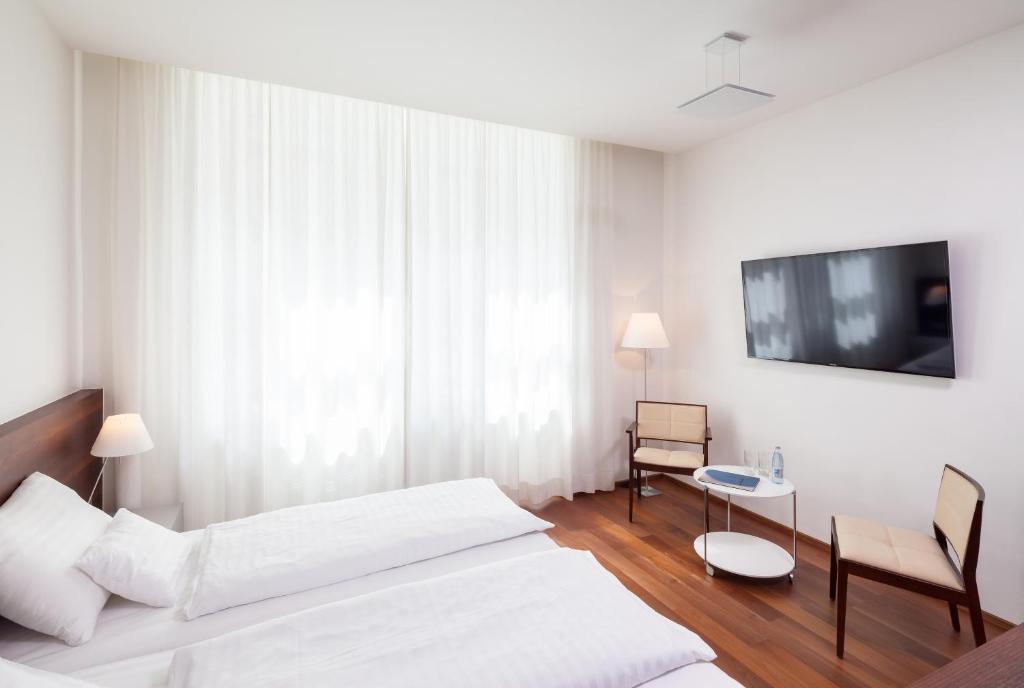 Postel nebo postele na pokoji v ubytování Hotel Central
