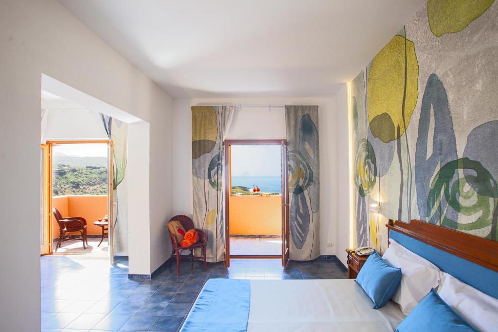 A bed or beds in a room at Suvaki Resort
