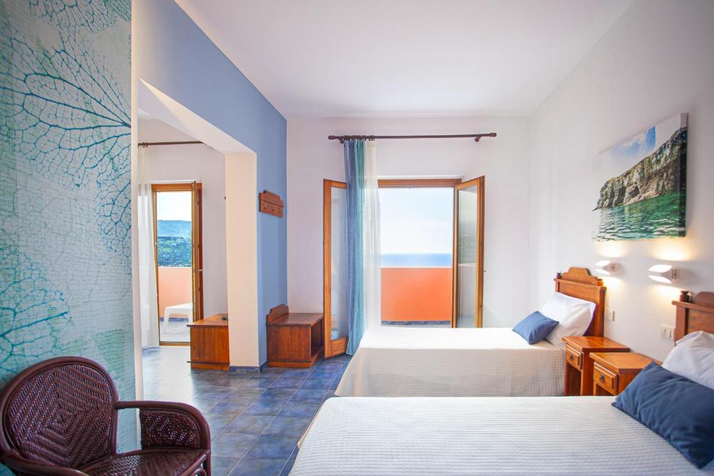 A bed or beds in a room at Suvaki Resort