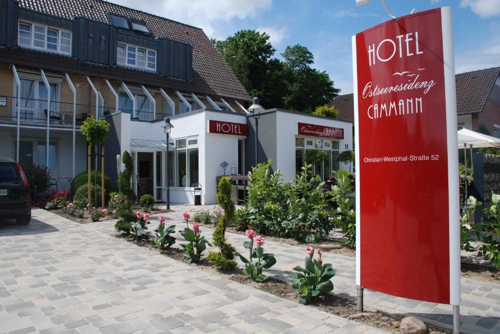 a hotel sign in front of a building at Hotel Ostseeresidenz Cammann Grömitz in Grömitz