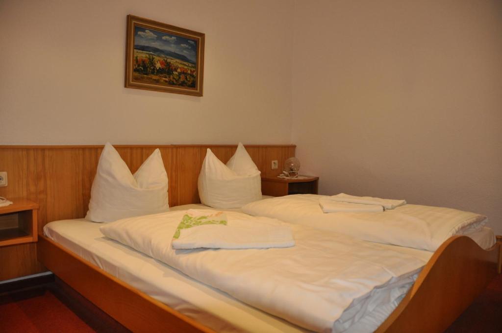 Voodi või voodid majutusasutuse Hotel Berggarten toas