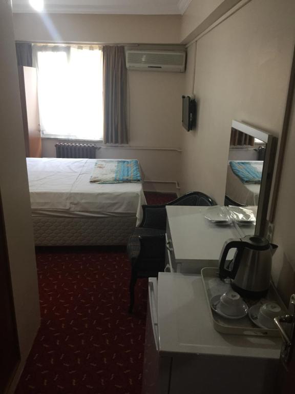 Postel nebo postele na pokoji v ubytování Paris Hotel