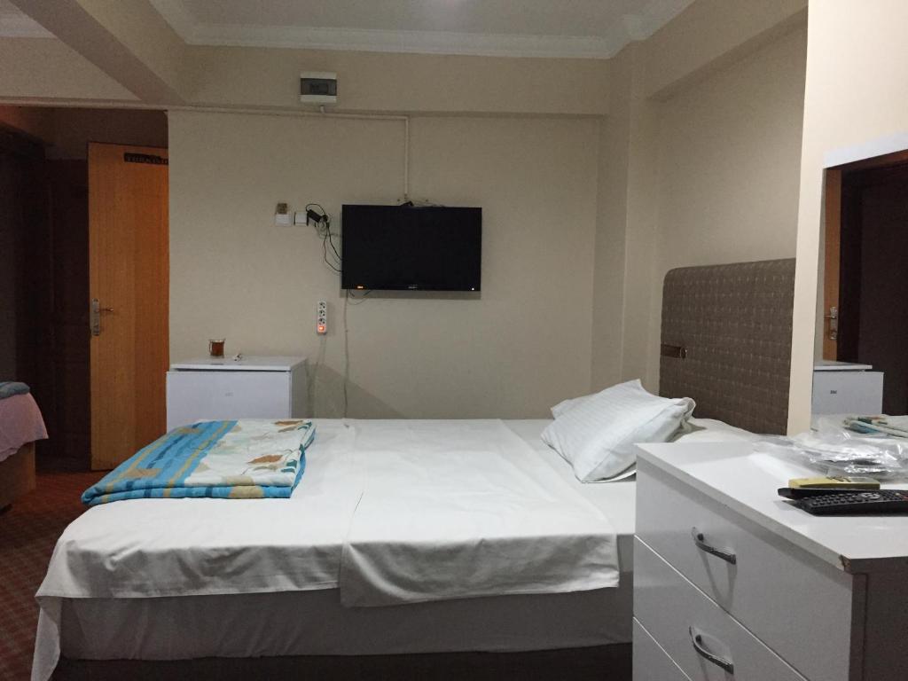 Postel nebo postele na pokoji v ubytování Paris Hotel
