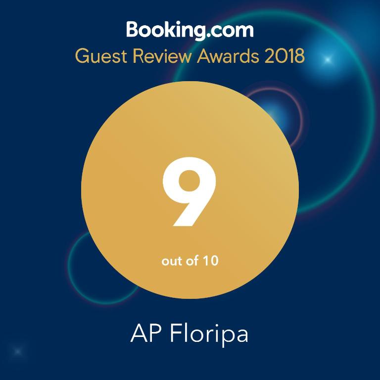 a yellow circle with the number on it with the text quest review awards at AP Floripa in Florianópolis