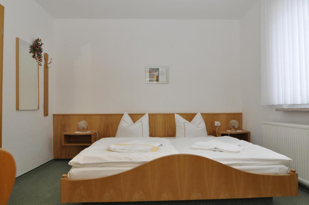 Voodi või voodid majutusasutuse Hotel Berggarten toas