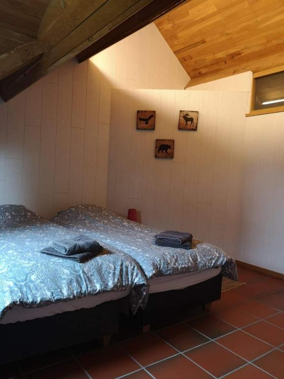 Postel nebo postele na pokoji v ubytování Le Durbuy Lodge