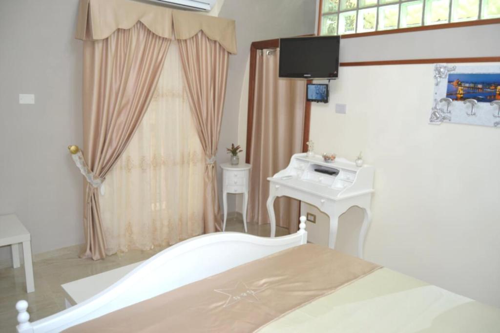 Posteľ alebo postele v izbe v ubytovaní B&B Punto Stella