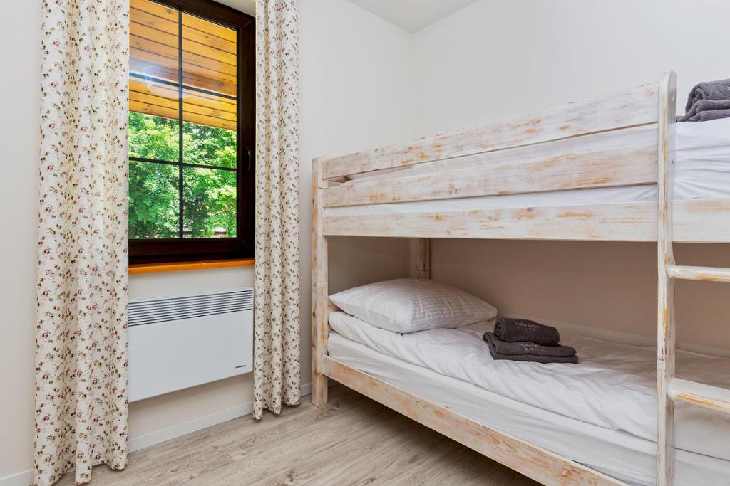 Postel nebo postele na pokoji v ubytování Warmia Resort