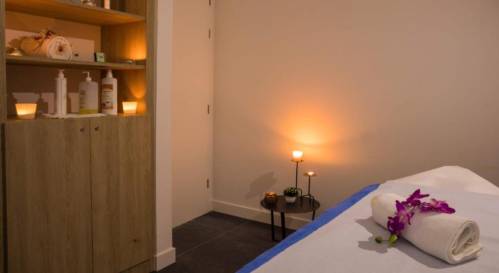 Postel nebo postele na pokoji v ubytování Hotel Osmine