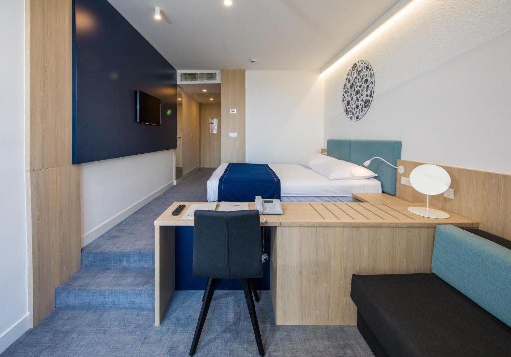 Postel nebo postele na pokoji v ubytování Hotel Osmine