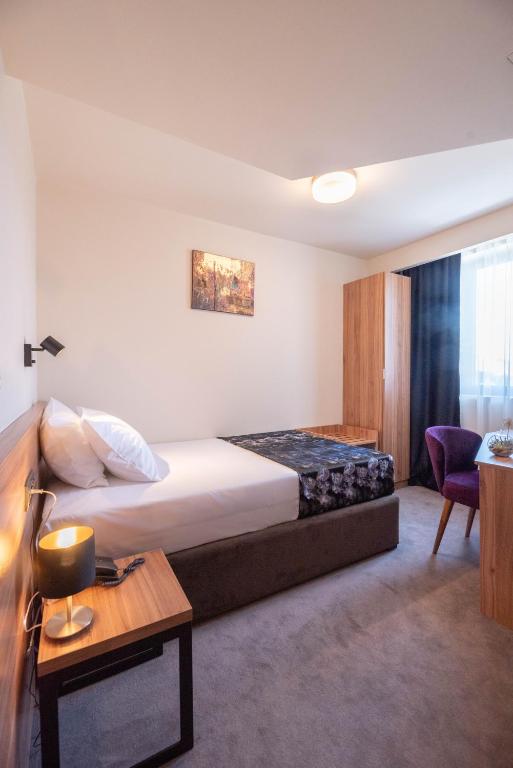 Postel nebo postele na pokoji v ubytování Hotel Aloha