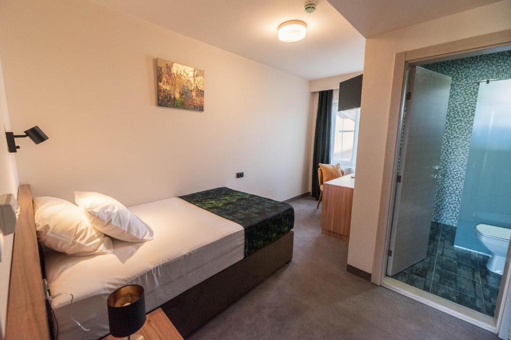 Postel nebo postele na pokoji v ubytování Hotel Aloha