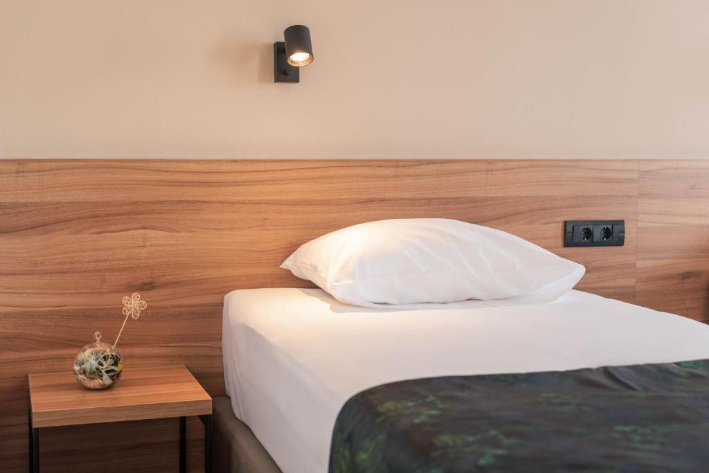 Postel nebo postele na pokoji v ubytování Hotel Aloha