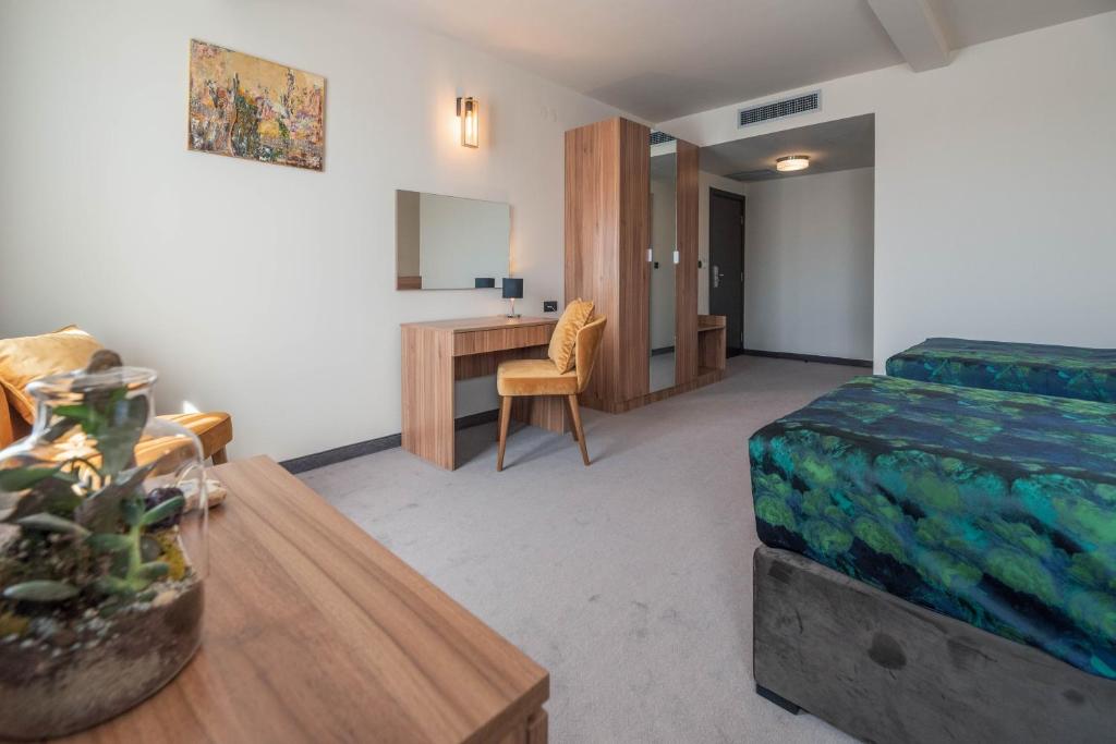 Postel nebo postele na pokoji v ubytování Hotel Aloha