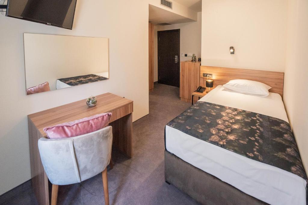Postel nebo postele na pokoji v ubytování Hotel Aloha