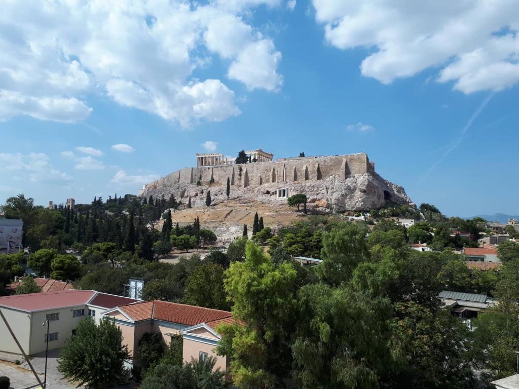 a castle on top of a hill at Check Point - Acropolis in Athens