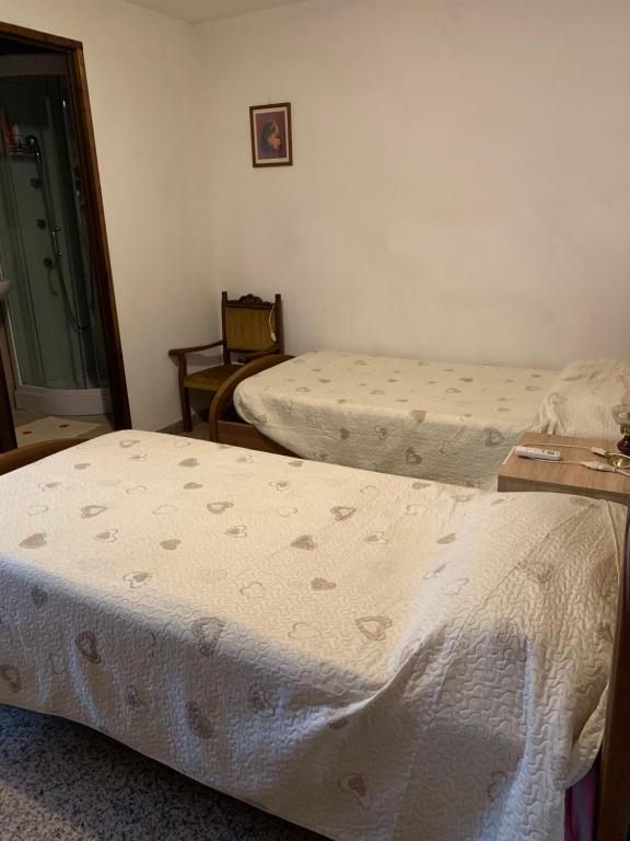 Letto o letti in una camera di Camere Solidea