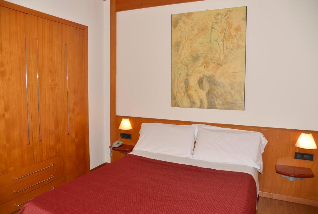 Postel nebo postele na pokoji v ubytování Hotel Giotto