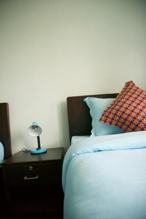 Ένα ή περισσότερα κρεβάτια σε δωμάτιο στο Hope Guest House