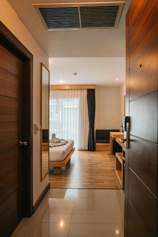 Postel nebo postele na pokoji v ubytování iCheck inn Central Patong