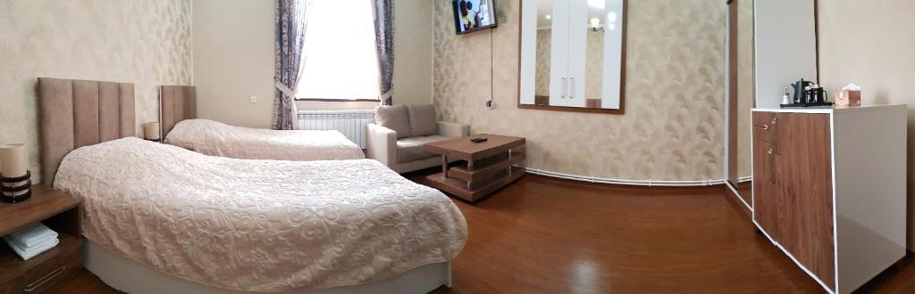 Postel nebo postele na pokoji v ubytování Ahana Hotel